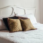 bedroom-bed-with-brown-throw-pillows