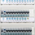 Close up of a modern home electrical panel with automatic fuses