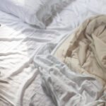 white-pillows-and-sheets-on-an-unmade-bed